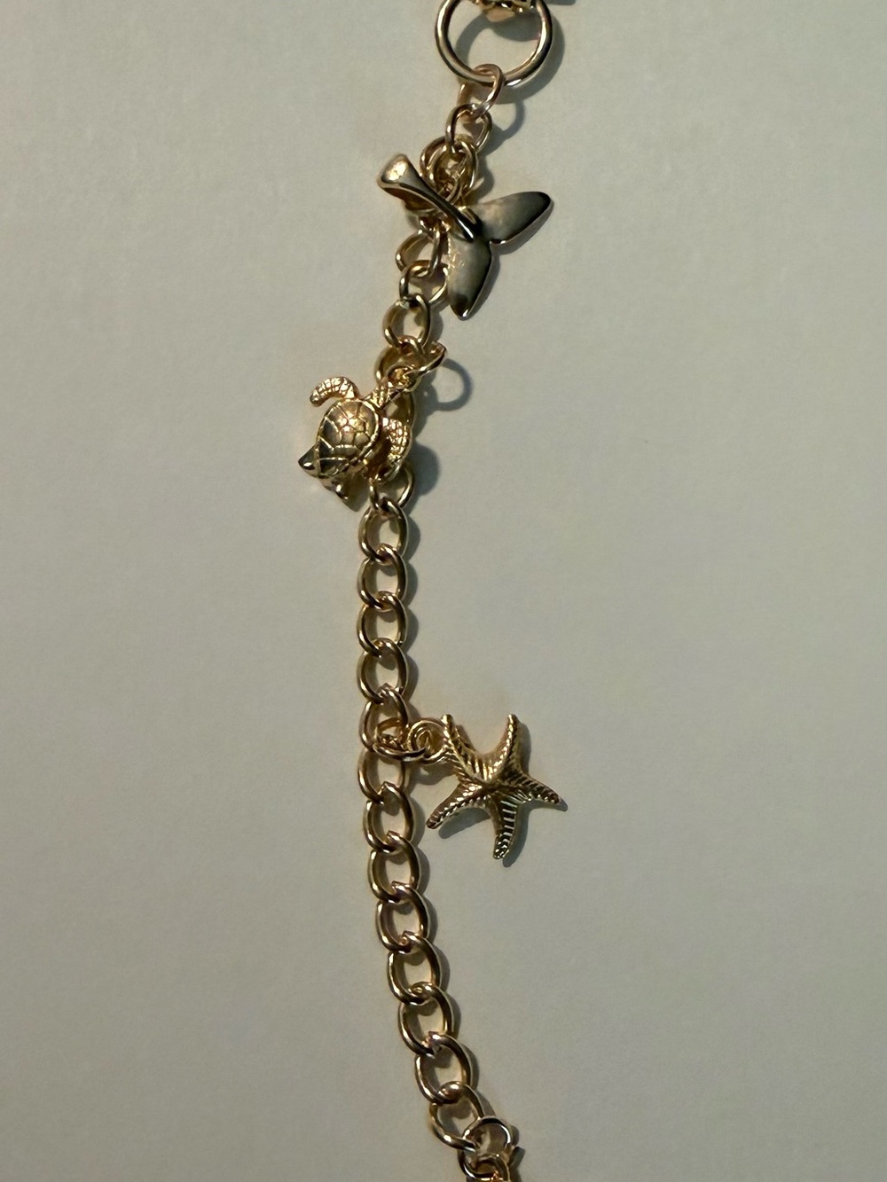 Gold-Tone Sea Life lip gloss / bag Charm  - Gold Color